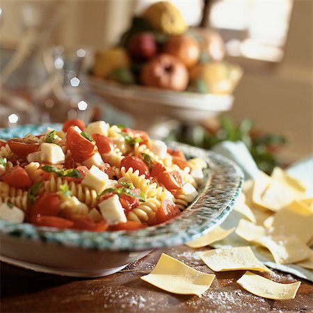 fusilli - Fresh pasta salad with fusilli, cherry tomatoes, mozzarella cheese and basil Stock Photo - Premium Royalty-Free, Code: 695-05773143