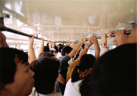 pictures of a person standing inside a bus - China, Hebei Province, Beijing, crowded bus Stock Photo - Premium Royalty-Free, Code: 695-05773166