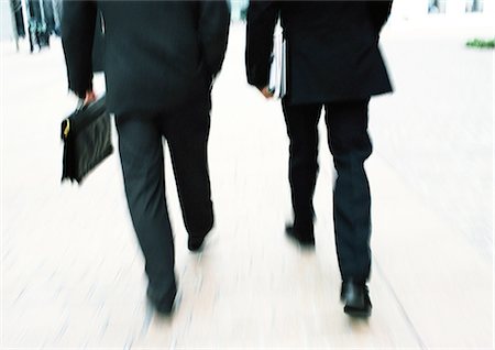 simsearch:695-05770017,k - Businessmen walking together, lower section, blurred. Stock Photo - Premium Royalty-Free, Code: 695-05773289