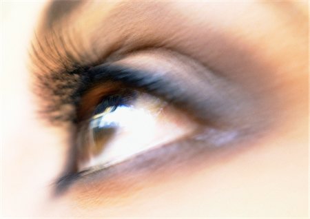 simsearch:400-04624555,k - Woman's brown eye, side view, blurred. Fotografie stock - Premium Royalty-Free, Codice: 695-05773293