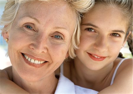 simsearch:695-05773387,k - Young girl hugging mature woman from behind, close up, portrait Stock Photo - Premium Royalty-Free, Code: 695-05773422