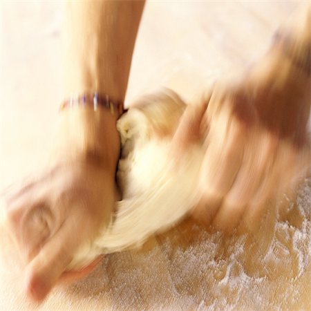 Hands kneading dough, blurred motion Stock Photo - Premium Royalty-Free, Code: 695-05773451