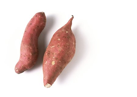 sweet potatoes raw - Two sweet potatoes, full length Stock Photo - Premium Royalty-Free, Code: 695-05773534