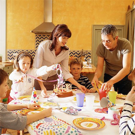 simsearch:695-03384582,k - Family gathered around table for birthday party Stock Photo - Premium Royalty-Free, Code: 695-05773782