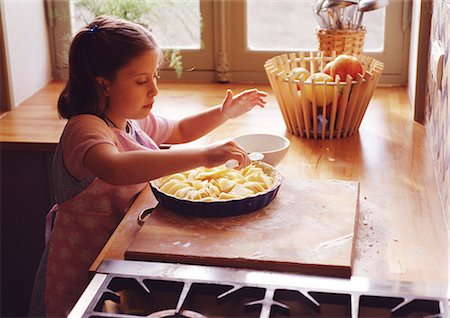 Child preparing pie Stock Photo - Premium Royalty-Free, Code: 695-05773791