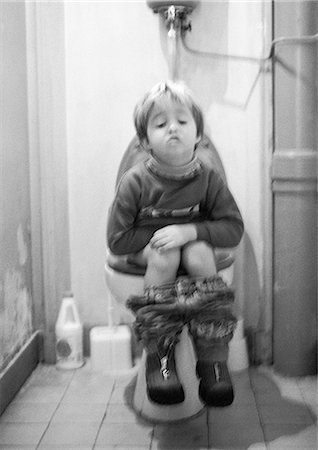 people sitting on the toilet photos - Little girl sitting on toilet, b&w Stock Photo - Premium Royalty-Free, Code: 695-05773919