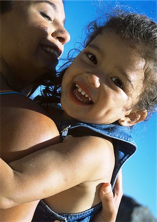 Woman holding child, close-up Stock Photo - Premium Royalty-Free, Code: 695-05773969