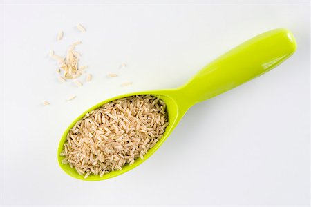 rice isolated - Scoop of brown rice Stock Photo - Premium Royalty-Free, Code: 695-05780023