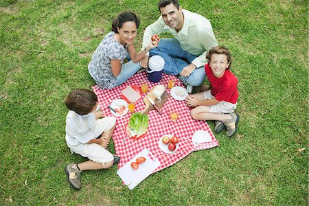 eating top view - Family enjoying picnic outdoors Stock Photo - Premium Royalty-Free, Code: 695-05780149