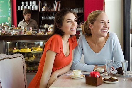 pastries woman cafe - Female friends together at cafe Stock Photo - Premium Royalty-Free, Code: 695-05780162