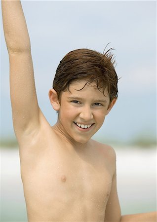 Boy with arm raised, portrait Stock Photo - Premium Royalty-Free, Code: 695-03374019