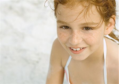 redhead girl swim suit - Girl smiling on beach, portrait Stock Photo - Premium Royalty-Free, Code: 695-03374032