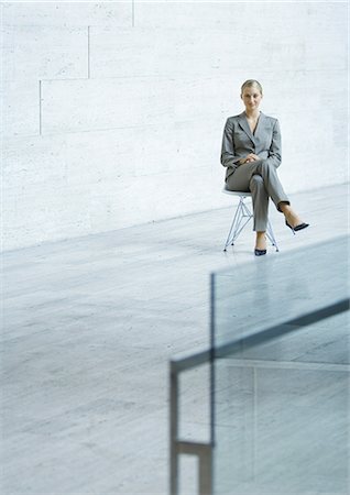 Businesswoman sitting, portrait Stock Photo - Premium Royalty-Free, Code: 695-03374268