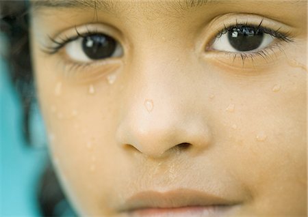 Girl's wet face, extreme close-up Stock Photo - Premium Royalty-Free, Code: 695-03374350