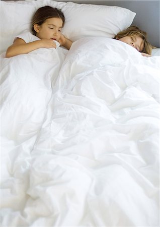 eiderdown duvet white - Two children sleeping in bed Stock Photo - Premium Royalty-Free, Code: 695-03374403