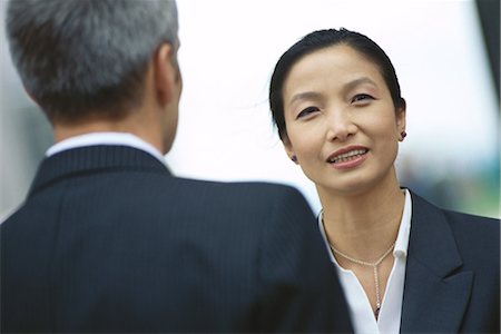 simsearch:632-01155400,k - Business partners talking, face to face Stock Photo - Premium Royalty-Free, Code: 695-03374484