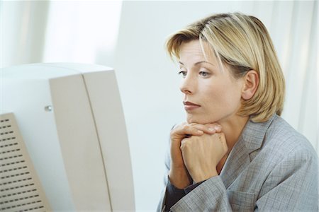 Businesswoman using desktop computer Stock Photo - Premium Royalty-Free, Code: 695-03374480
