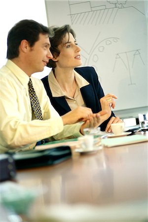 draw the diagram of male and female - Business people sitting at conference table Stock Photo - Premium Royalty-Free, Code: 695-03374502