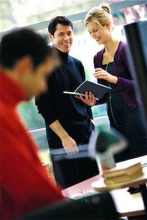simsearch:695-03374588,k - Two business colleagues looking at agenda, laughing Stock Photo - Premium Royalty-Free, Code: 695-03374585