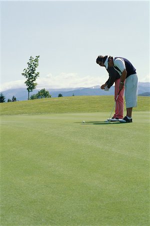 Golfer taking lessons Fotografie stock - Premium Royalty-Free, Codice: 695-03374622