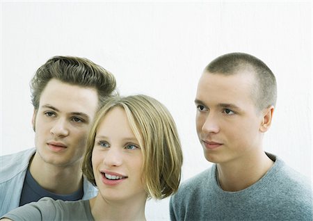 simsearch:400-03929864,k - Three young friends, looking out of frame Stock Photo - Premium Royalty-Free, Code: 695-03374775