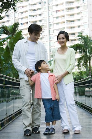 Family standing on walkway, portrait Stock Photo - Premium Royalty-Free, Code: 695-03374899
