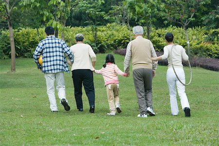 Three generation family, walking together, rear view Stock Photo - Premium Royalty-Free, Code: 695-03374945