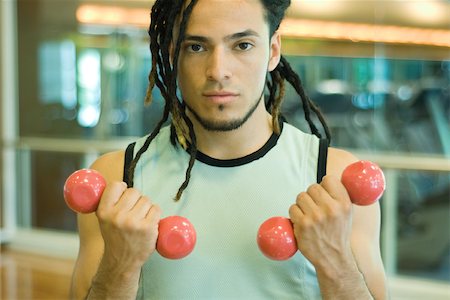 simsearch:695-03375202,k - Young man working out with dumbbells Stock Photo - Premium Royalty-Free, Code: 695-03375110