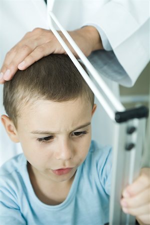 paediatrician (male) - Doctor measuring boy during check-up Stock Photo - Premium Royalty-Free, Code: 695-03375272