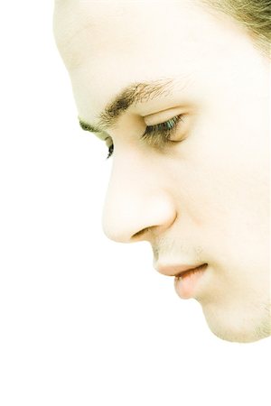 simsearch:695-05766182,k - Young man's face, profile, extreme close-up Fotografie stock - Premium Royalty-Free, Codice: 695-03375619