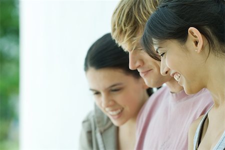simsearch:695-03377942,k - Young friends, looking down, close-up Stock Photo - Premium Royalty-Free, Code: 695-03375693