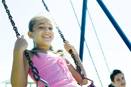 Child on swing Stock Photo - Premium Royalty-Free, Code: 695-03375933