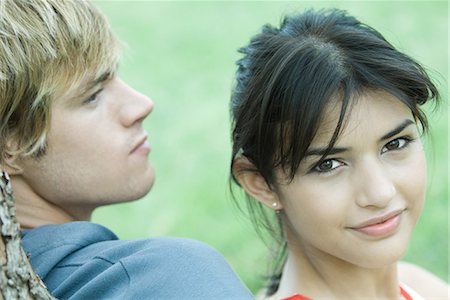 Young couple, woman smiling at camera, portrait Stock Photo - Premium Royalty-Free, Code: 695-03376061