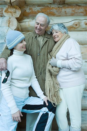 simsearch:695-03377503,k - Teen girl with grandparents, wearing winter clothes, standing in front of log cabin, portrait Stock Photo - Premium Royalty-Free, Code: 695-03376180