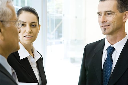 simsearch:695-03376535,k - Three business associates chatting, cropped view Stock Photo - Premium Royalty-Free, Code: 695-03376221