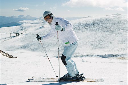 simsearch:696-03401844,k - Young skier smiling at camera, full length portrait Stock Photo - Premium Royalty-Free, Code: 695-03376443