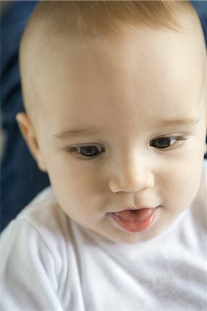 Baby with mouth open, close-up, headshot Stock Photo - Premium Royalty-Free, Code: 695-03376634