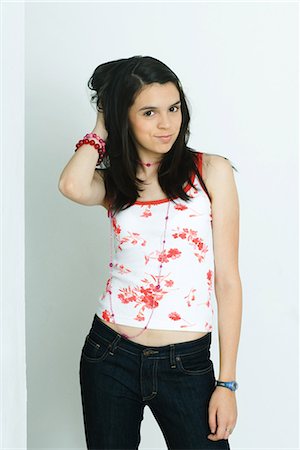 Teenage girl in tank top and jeans Stock Photos - Page 1 : Masterfile