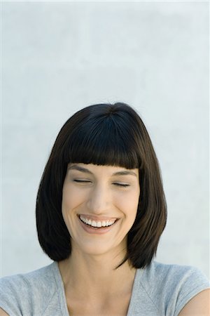 simsearch:695-05766280,k - Young woman laughing, eyes closed, portrait Stock Photo - Premium Royalty-Free, Code: 695-03376717