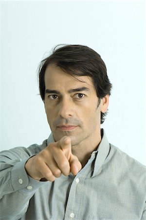 Man pointing at camera, portrait Stock Photo - Premium Royalty-Free, Code: 695-03376736