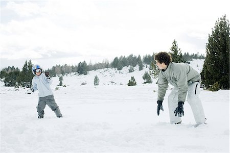 Young friends having snowball fight Stock Photo - Premium Royalty-Free, Code: 695-03377039