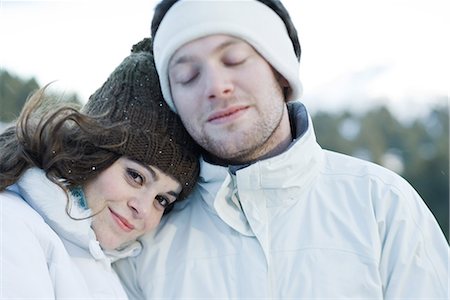 simsearch:649-08894835,k - Young couple in ski clothes, young woman resting head on boyfriend's shoulder Stock Photo - Premium Royalty-Free, Code: 695-03377047