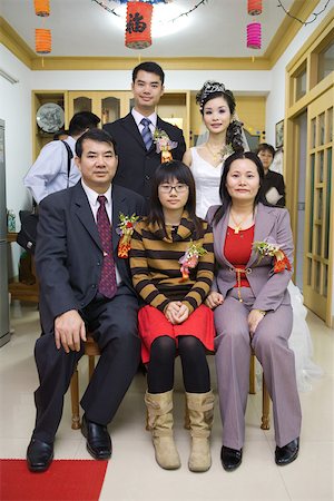 simsearch:695-03377429,k - Bride and groom with family, group portrait, full length, front view Stock Photo - Premium Royalty-Free, Code: 695-03377465