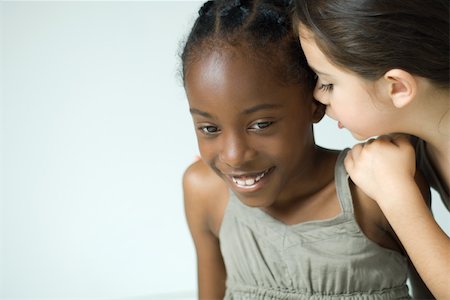 simsearch:695-03388837,k - Girl whispering in friends ear, cropped view Stock Photo - Premium Royalty-Free, Code: 695-03377512