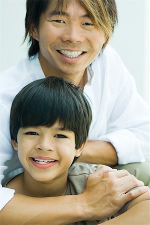 simsearch:632-01148477,k - Father and son smiling at camera together, portrait Stock Photo - Premium Royalty-Free, Code: 695-03377857