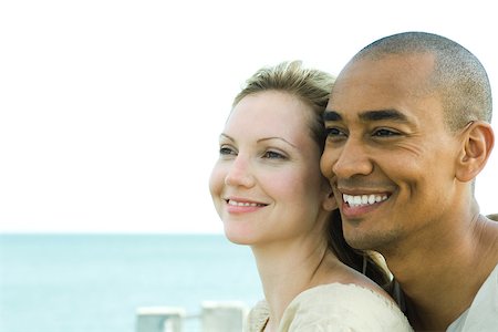 simsearch:696-03402108,k - Couple looking away and smiling together, close-up Stock Photo - Premium Royalty-Free, Code: 695-03377870