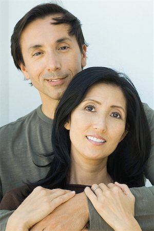 portrait and woman and closeup and arms - Couple embracing, both smiling at camera, portrait Stock Photo - Premium Royalty-Free, Code: 695-03377887