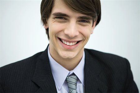 simsearch:695-03390134,k - Young man in suit smiling at camera, portrait, close-up Stock Photo - Premium Royalty-Free, Code: 695-03378495