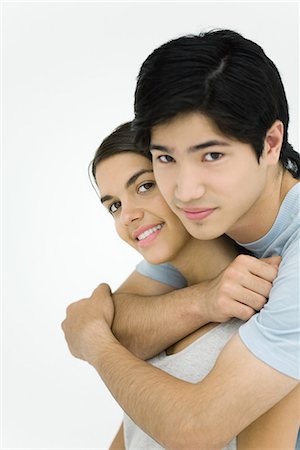 simsearch:695-03390134,k - Young couple smiling at camera, embracing, portrait Stock Photo - Premium Royalty-Free, Code: 695-03379115