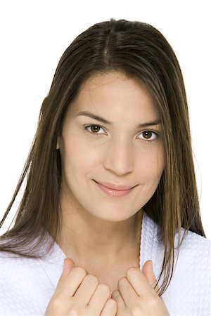 Young woman smiling at camera, portrait Stock Photo - Premium Royalty-Free, Code: 695-03379571